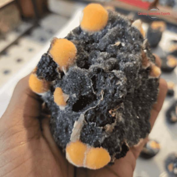 Yellow thomsonite boll with black chalcedony matrix