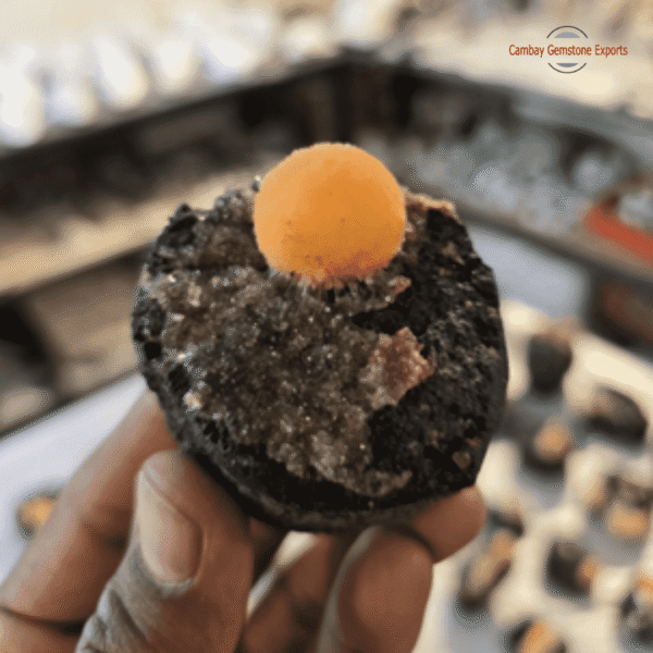 Yellow thomsonite boll with black chalcedony matrix